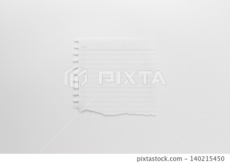 A photograph taken from directly above of a page in a notepad with the bottom torn off, against a white background. A photograph taken from directly above of a page in a notepad with the bottom torn off, against a white background. 140215450