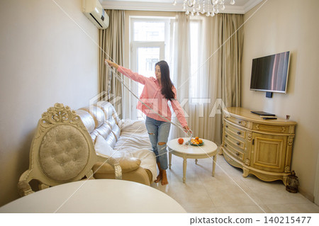 Nice brunette woman knitting wool using needle at home 140215477