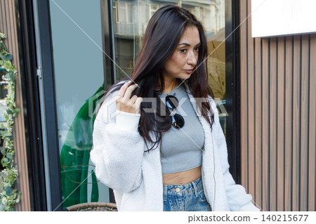 Casual woman on a city street, closeup portrait 140215677