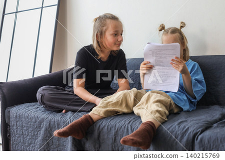 Cute little girl and boy children having fun at home Cute little girl and boy children having fun at home 140215769
