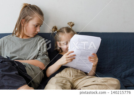 Little sibling learning a role for the school drama club at home Little sibling learning a role for the school drama club at home 140215776