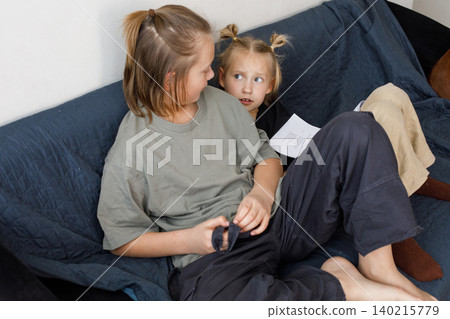 Attractive children reading and learning at home Attractive children reading and learning at home 140215779