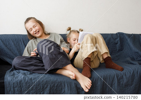 Laughing children little girl and boy children having fun at home 140215780