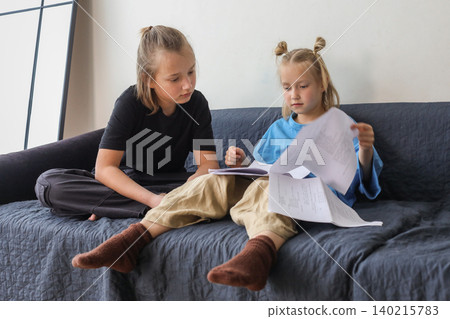 Attractive little girl and boy children having fun at home Attractive little girl and boy children having fun at home 140215783