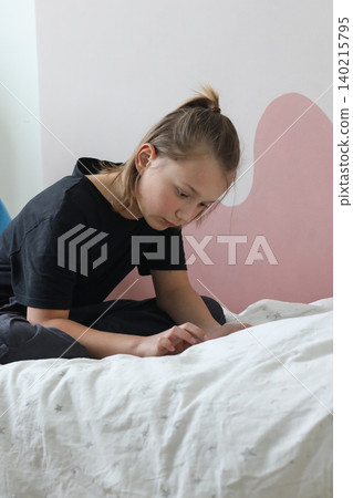 Young child with gadget pc tablet sitting at home Young child with gadget pc tablet sitting at home 140215795