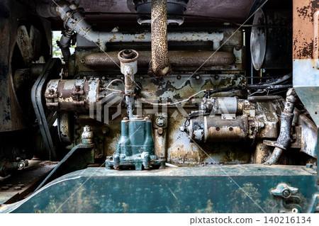 The rusty old engine of a trolley locomotive that has been used for many years. The rusty old engine of a trolley locomotive that has been used for many years. 140216134