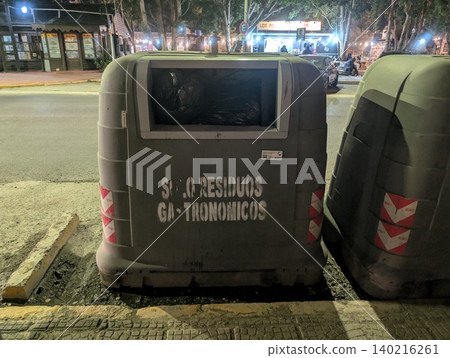 El Calafate, Patagonia, Argentina - March 8, 2026: Food waste recycling container on a city street El Calafate, Patagonia, Argentina - March 8, 2026: Food waste recycling container on a city street 140216261