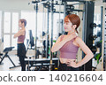 Young woman stretching in the gym 140216604