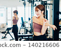 Young woman stretching in the gym 140216606