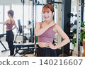 Young woman stretching in the gym 140216607