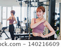 Young woman stretching in the gym 140216609