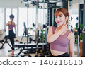 Young woman stretching in the gym 140216610