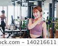 Young woman stretching in the gym 140216611