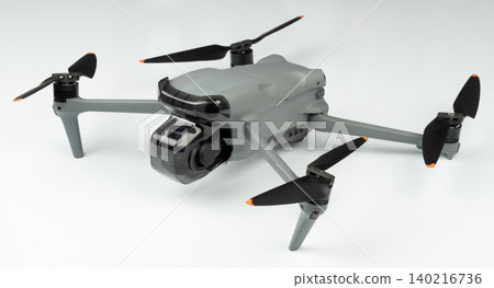 Drone sits on a plain surface ready for flight and capture 140216736