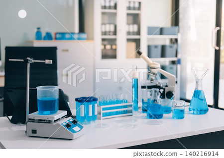 Lab technician experimenting in lab Lab technician experimenting in lab 140216914