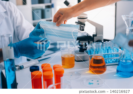 Lab technician experimenting in lab 140216927