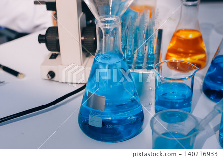 Lab technician experimenting in lab Lab technician experimenting in lab 140216933