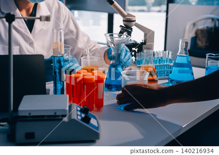 Lab technician experimenting in lab Lab technician experimenting in lab 140216934
