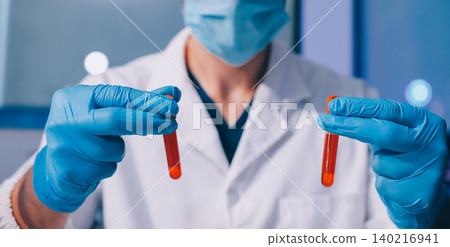 Lab technician experimenting in lab 140216941