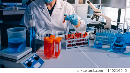 Lab technician experimenting in lab Lab technician experimenting in lab 140216943