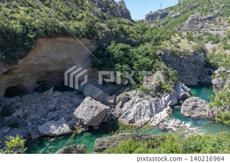 Mountain river canyon with turquoise water and rocky cliffs in Montenegro landscape Mountain river canyon with turquoise water and rocky cliffs in Montenegro landscape 140216964
