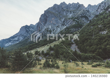 Rugged limestone peaks and green valley in Prokletije National Park, Montenegro 140216980