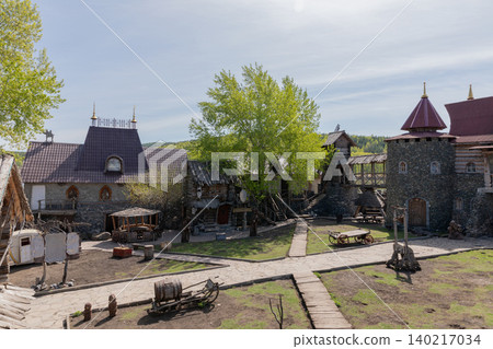 Sonkina Laguna park courtyard with medieval style buildings in Satka, Russia Sonkina Laguna park courtyard with medieval style buildings in Satka, Russia 140217034