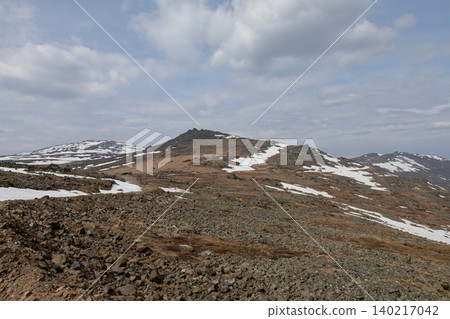 Rocky tundra landscape on Konzhakovsky Stone mountain ridge under cloudy sky Rocky tundra landscape on Konzhakovsky Stone mountain ridge under cloudy sky 140217042