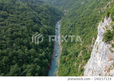 Tara River Canyon aerial view with turquoise river and forested cliffs Tara River Canyon aerial view with turquoise river and forested cliffs 140217119