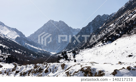 Winter mountain landscape in Issyk-Ata Gorge with snowy peaks and valley view Winter mountain landscape in Issyk-Ata Gorge with snowy peaks and valley view 140217153