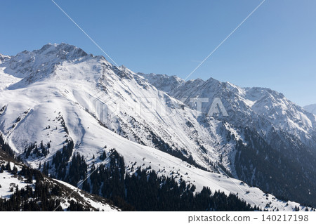 Snowy mountain panorama above Karakol ski resort in winter, Kyrgyzstan 140217198