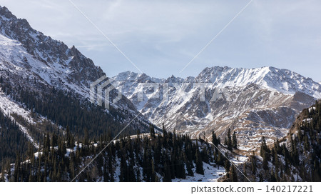 Snowy mountain landscape in Barskoon Gorge with conifer forest, Kyrgyzstan Snowy mountain landscape in Barskoon Gorge with conifer forest, Kyrgyzstan 140217221