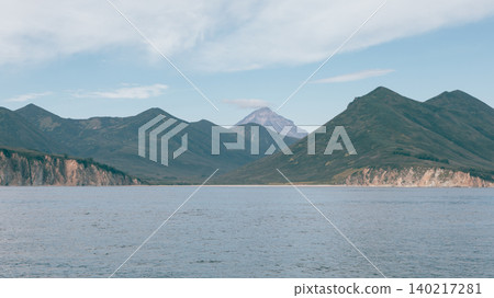 Vilyuchinskaya Bay seascape with distant volcano, Kamchatka Peninsula Vilyuchinskaya Bay seascape with distant volcano, Kamchatka Peninsula 140217281