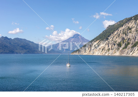 Sailboat in Vilyuchinskaya Bay with Vilyuchinsky Volcano, Kamchatka Peninsula Sailboat in Vilyuchinskaya Bay with Vilyuchinsky Volcano, Kamchatka Peninsula 140217305