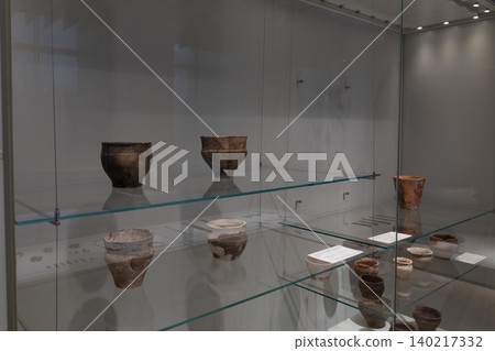 Ancient pottery artifacts displayed in glass case at Bishkek history museum Ancient pottery artifacts displayed in glass case at Bishkek history museum 140217332