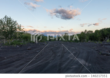 Remote volcanic ash track at sunset near Mount Etna, Sicily countryside 140217351