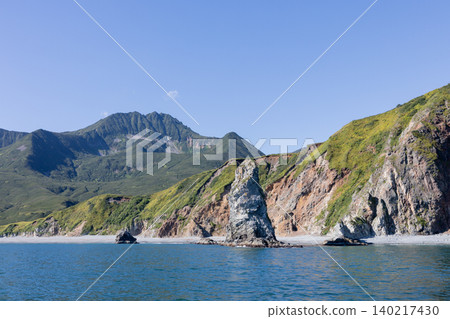 Rugged sea cliffs and volcanic mountains on the Kamchatka Peninsula coastline Rugged sea cliffs and volcanic mountains on the Kamchatka Peninsula coastline 140217430