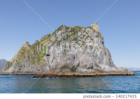 Rocky sea stack island in Avacha Bay near Petropavlovsk-Kamchatsky, Kamchatka Rocky sea stack island in Avacha Bay near Petropavlovsk-Kamchatsky, Kamchatka 140217435