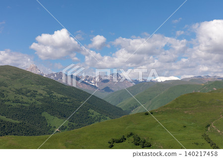 Panoramic Caucasus Mountains landscape with green hills in Kabardino-Balkaria Panoramic Caucasus Mountains landscape with green hills in Kabardino-Balkaria 140217458