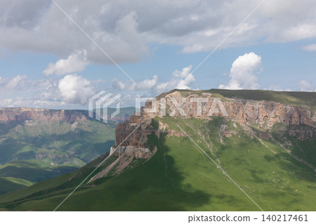 View from Mount Naudzhidza plateau with dramatic cliffs and clouds View from Mount Naudzhidza plateau with dramatic cliffs and clouds 140217461