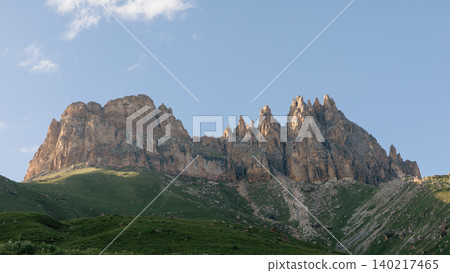 Dramatic rocky peaks of Mount Naudzhidza under blue sky in Caucasus landscape Dramatic rocky peaks of Mount Naudzhidza under blue sky in Caucasus landscape 140217465