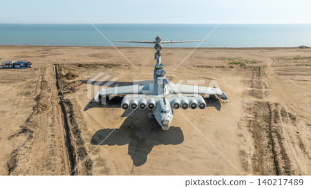 Abandoned Soviet ekranoplan on Caspian Sea coast near Arablyar, aerial view Abandoned Soviet ekranoplan on Caspian Sea coast near Arablyar, aerial view 140217489
