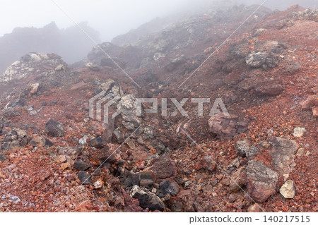 Foggy volcanic rocks and red scoria landscape in Tolbachinsky Dol valley, Kamchatka Foggy volcanic rocks and red scoria landscape in Tolbachinsky Dol valley, Kamchatka 140217515