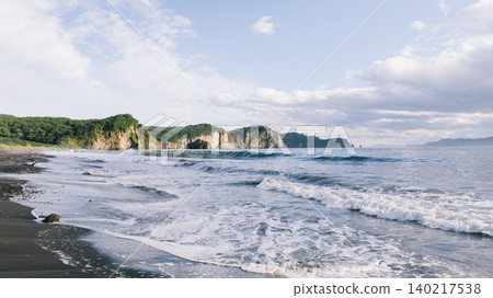 Pacific Ocean surf and black sand beach coastline landscape in Kamchatka 140217538