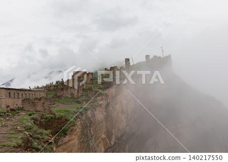 Misty ruins of Old Goor fortress village on a cliff in the Caucasus Mountains Misty ruins of Old Goor fortress village on a cliff in the Caucasus Mountains 140217550