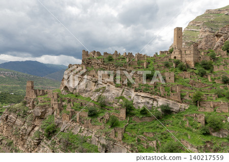 Ancient stone tower ruins on mountain slope in Kahib village, Dagestan, Russia 140217559