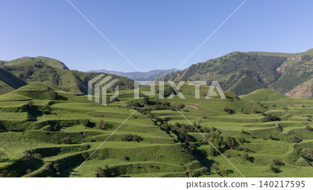 Panoramic view of Chokh terraces and green mountain hills near Chokh village 140217595