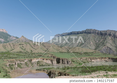 Mountain valley and river canyon landscape in Dagestan with clear blue sky panorama 140217597