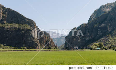 Green valley and dramatic rocky mountains in Dagestan, Caucasus landscape Green valley and dramatic rocky mountains in Dagestan, Caucasus landscape 140217598