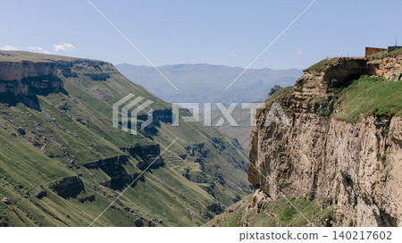 Mountain canyon cliffs and green valley on the Khunzakh Plateau, Dagestan Mountain canyon cliffs and green valley on the Khunzakh Plateau, Dagestan 140217602